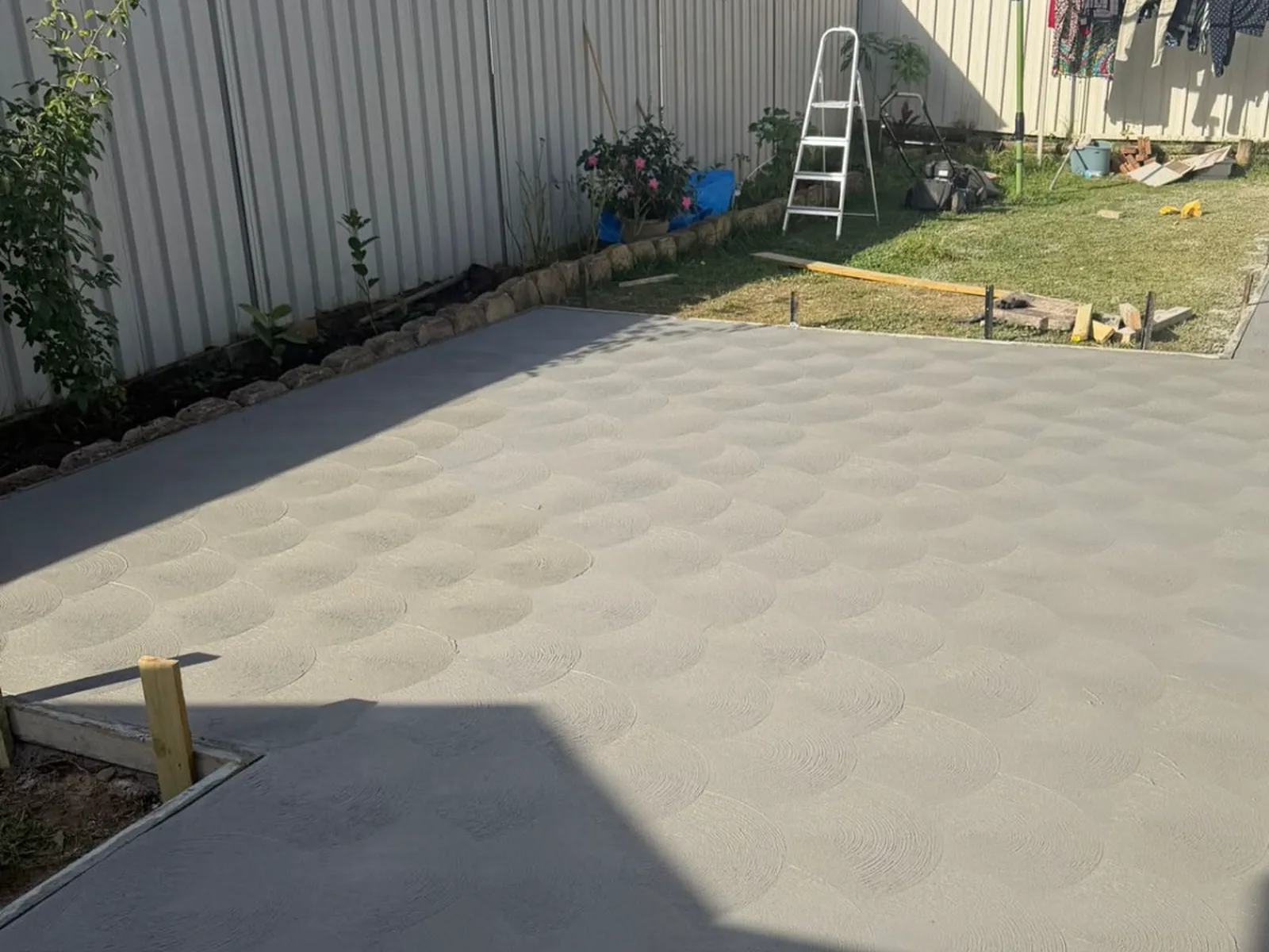 Ausee concrete patio and perimeter pathway